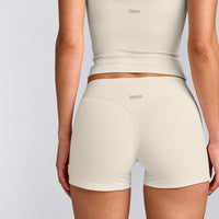 SoftMotion™ Double Layer Mid Rise Shorts 4" with Grey Logo | Marshmallow White