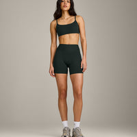 SoftMotion™ Strappy Sports Bra with Grey Logo | Emerald Noir