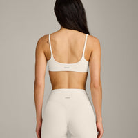 SoftMotion™ Strappy Sports Bra with Grey Logo | Marshmallow White