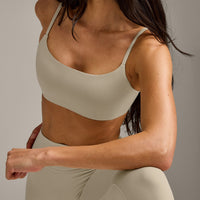 SoftMotion™ Strappy Sports Bra with Grey Logo | Oatmeal