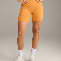 EffortlessLift™ Seamless Mid Rise Shorts with Grey Logo | Powdered Orange