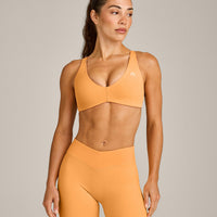 UnifiedMove™ Cross Back Sports Bra with Reflective Logo | Powdered Orange