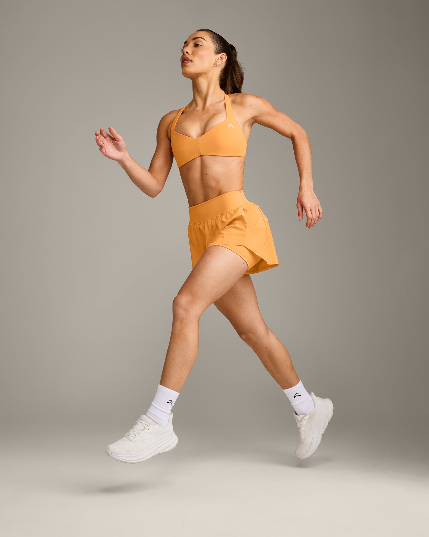 UnifiedMove™ T Back Minimal Bralette with Reflective Logo | Powdered Orange