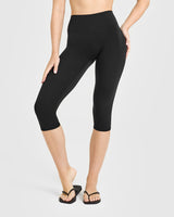 SoftMotion™ High Waisted Capri Leggings with White Logo | Black
