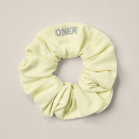 SoftMotion™ Scrunchie with Grey Logo | Pastel Yellow