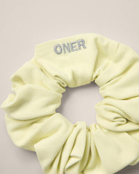 SoftMotion™ Scrunchie with Grey Logo | Pastel Yellow
