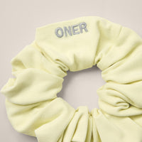 SoftMotion™ Scrunchie with Grey Logo | Pastel Yellow