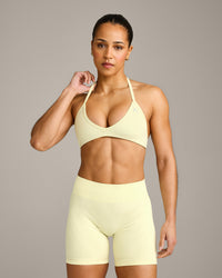EnhanceLift™ Seamless Minimal Halter Neck Bralette with Grey Logo | Pastel Yellow