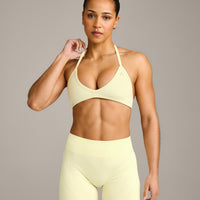 EnhanceLift™ Seamless Minimal Halter Neck Bralette with Grey Logo | Pastel Yellow