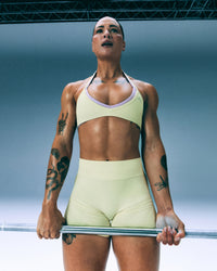 EnhanceLift™ Seamless Minimal Halter Neck Bralette with Grey Logo | Pastel Yellow