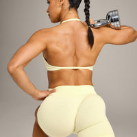 EnhanceLift™ Seamless Minimal Halter Neck Bralette with Grey Logo | Pastel Yellow