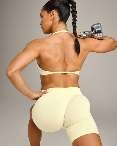 EnhanceLift™ Seamless Minimal Halter Neck Bralette with Grey Logo | Pastel Yellow