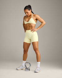 EnhanceLift™ Seamless Minimal Halter Neck Bralette with Grey Logo | Pastel Yellow