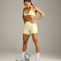 EnhanceLift™ Seamless Minimal Halter Neck Bralette with Grey Logo | Pastel Yellow