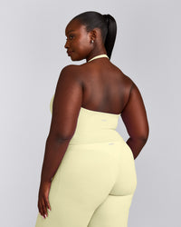 SoftMotion™ Halter Neck Mid Tank Top with Built in Bra Shelf with Gray Logo | Pastel Yellow