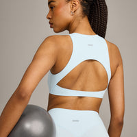 SoftMotion™ High Neck Sports Bra with Grey Logo |  Cloud Blue