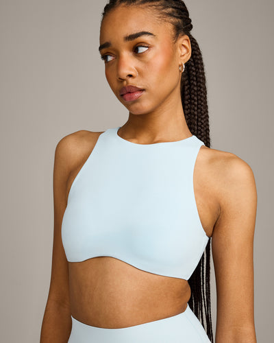 SoftMotion™ High Neck Sports Bra with Grey Logo |  Cloud Blue