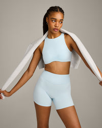 SoftMotion™ High Neck Sports Bra with Grey Logo |  Cloud Blue