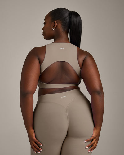 SoftMotion™ High Neck Sports Bra with Grey Logo | Minky