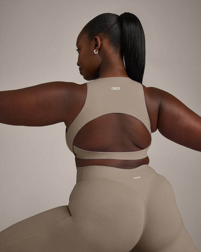 SoftMotion™ High Neck Sports Bra with Grey Logo | Minky