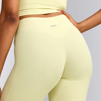 SoftMotion™ Flared Pants with Gray Logo | Pastel Yellow