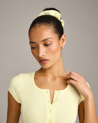 SoftMotion™ Scrunchie with Grey Logo | Pastel Yellow