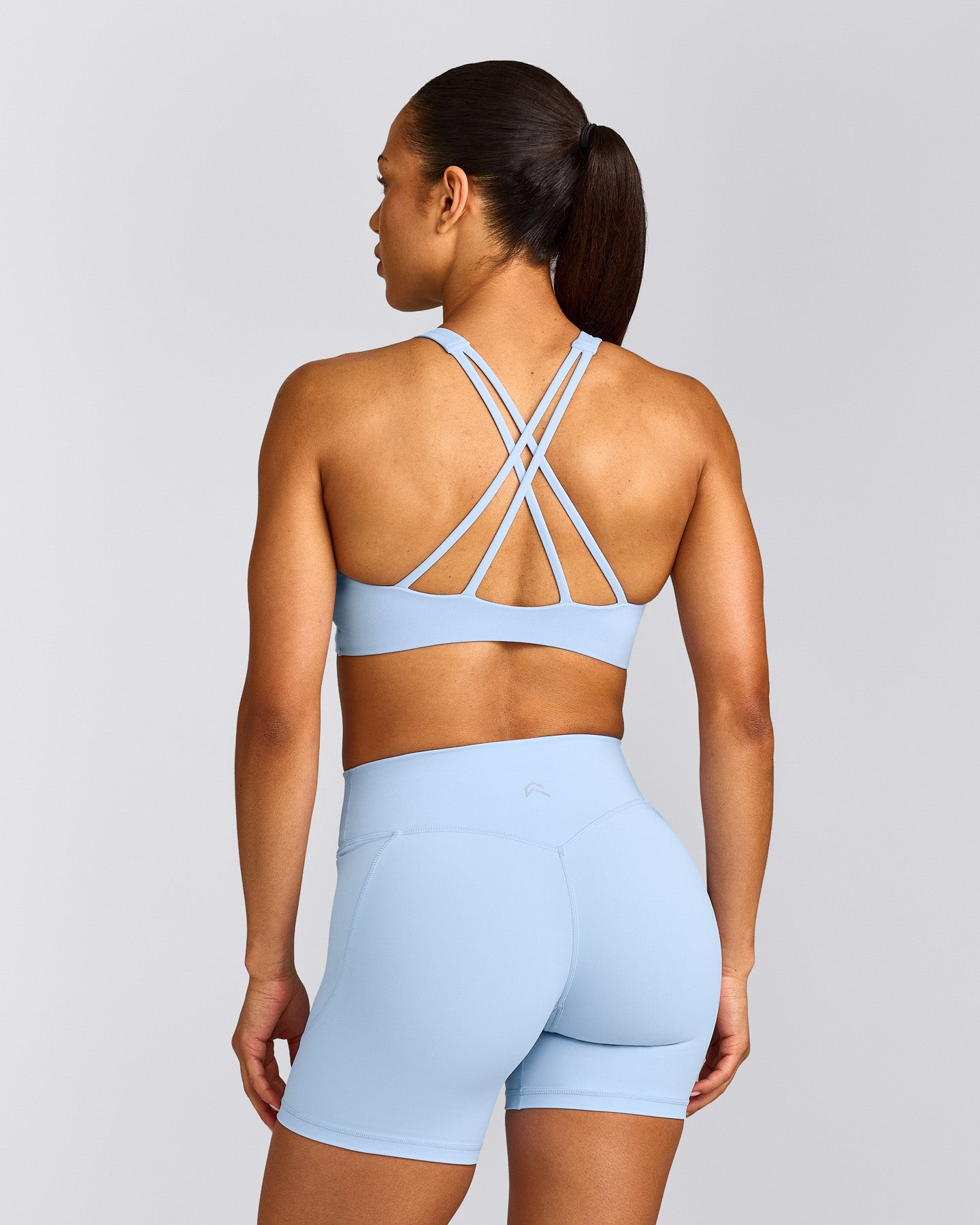EasyLift™ High Neck Sports Bra with Grey Logo | Powdered Blue