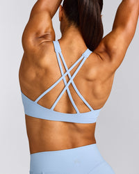 EasyLift™ High Neck Sports Bra with Grey Logo | Powdered Blue