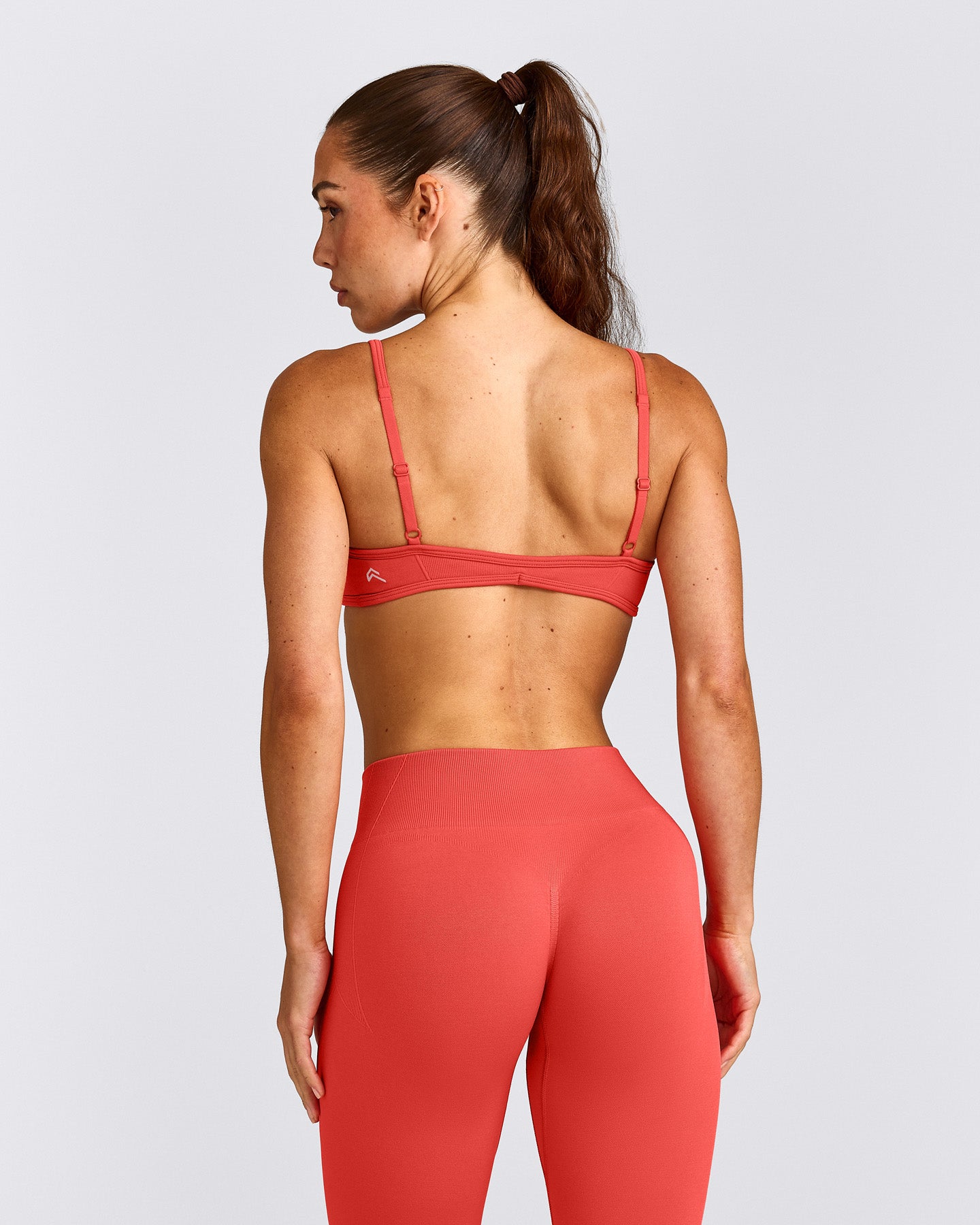 EnhanceLift™ Seamless Minimal Bralette with Grey Logo | Dark Charged Coral