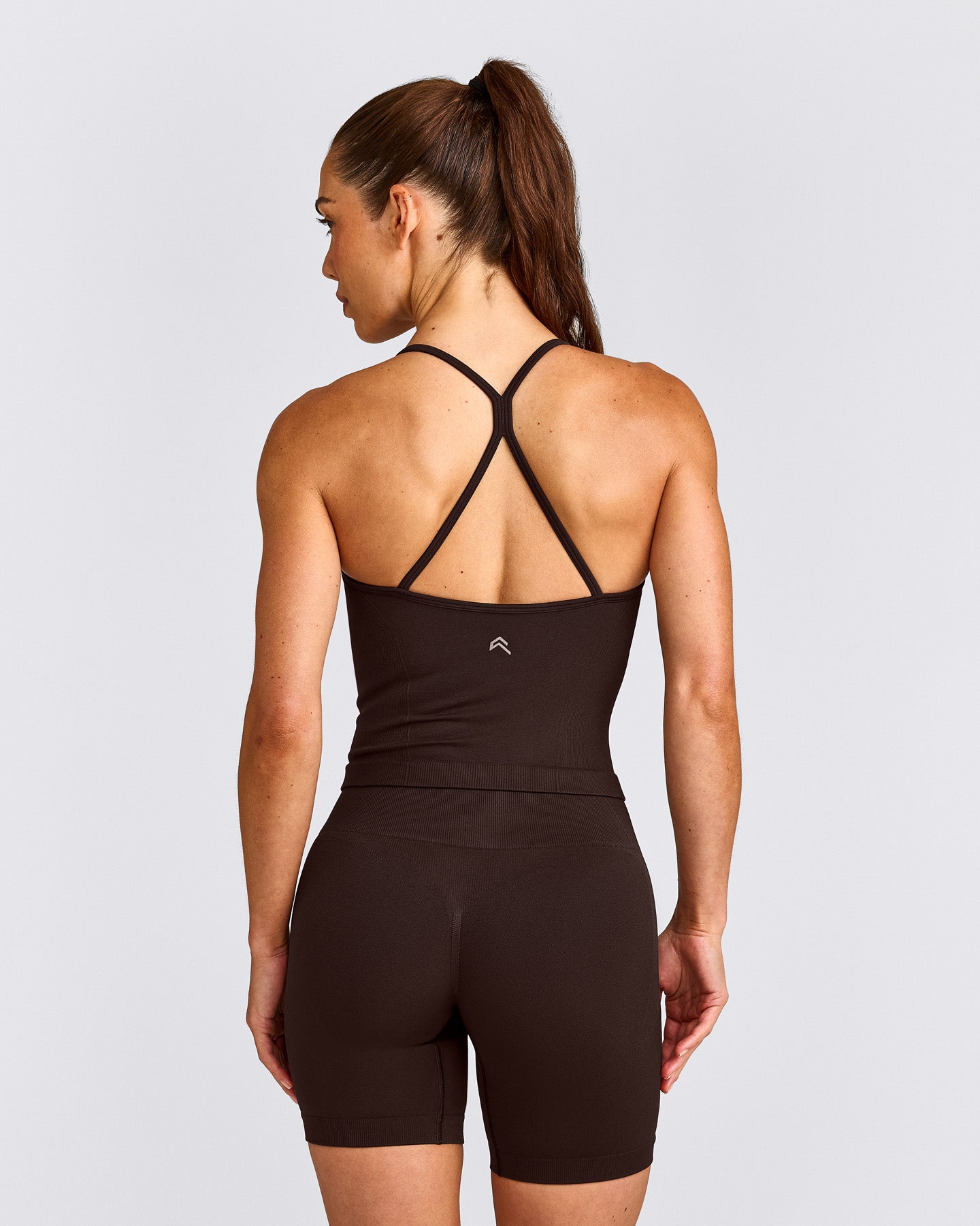 EnhanceLift™ Seamless Strappy Racer Vest with Built in Bra Shelf with Grey Logo | 70% Cocoa