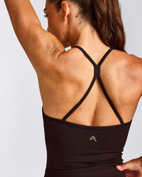 EnhanceLift™ Seamless Strappy Racer Vest with Built in Bra Shelf with Grey Logo | 70% Cocoa