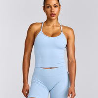 EnhanceLift™ Seamless Strappy Racer Vest with Built in Bra Shelf with Grey Logo | Powdered Blue