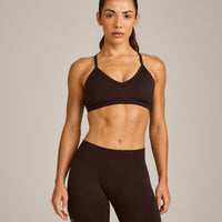 EnhanceLift™ Seamless Strappy Sports Bra with Grey Logo | 70% Cocoa