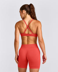 EnhanceLift™ Seamless Strappy Sports Bra with Grey Logo | Dark Charged Coral