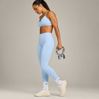 EnhanceLift™ Seamless Strappy Sports Bra with Grey Logo | Powdered Blue