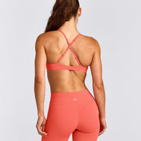 UnifiedMove™ Cross Back Sports Bra with Reflective Logo | Light Charged Coral