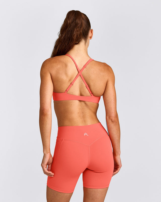 UnifiedMove™ Cross Back Sports Bra with Reflective Logo | Light Charged Coral
