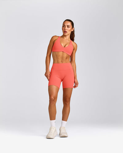 UnifiedMove™ Cross Back Sports Bra with Reflective Logo | Light Charged Coral