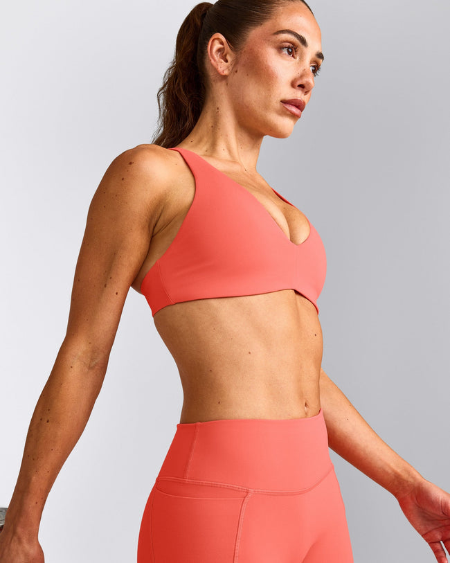UnifiedMove™ Cross Back Sports Bra with Reflective Logo | Light Charged Coral