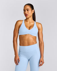 UnifiedMove™ Cross Back Sports Bra with Reflective Logo | Powdered Blue