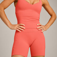 UnifiedMove™ T Back Mid Vest with Built in Bra Shelf with Reflective Logo | Light Charged Coral