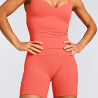 UnifiedMove™ T Back Mid Vest with Built in Bra Shelf with Reflective Logo | Light Charged Coral