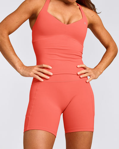 UnifiedMove™ T Back Mid Vest with Built in Bra Shelf with Reflective Logo | Light Charged Coral
