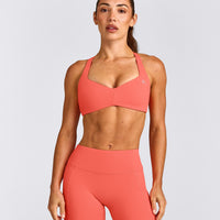 UnifiedMove™ T Back Minimal Bralette with Reflective Logo | Light Charged Coral