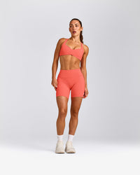 UnifiedMove™ T Back Minimal Bralette with Reflective Logo | Light Charged Coral