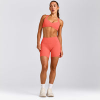 UnifiedMove™ T Back Minimal Bralette with Reflective Logo | Light Charged Coral