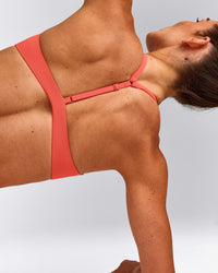 UnifiedMove™ T Back Minimal Bralette with Reflective Logo | Light Charged Coral