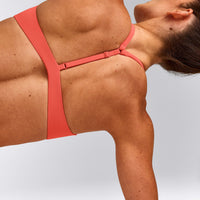 UnifiedMove™ T Back Minimal Bralette with Reflective Logo | Light Charged Coral