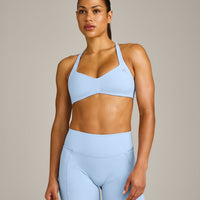UnifiedMove™ T Back Minimal Bralette with Reflective Logo | Powdered Blue