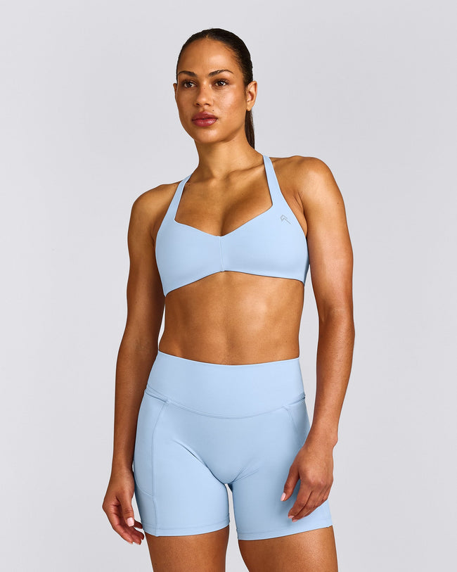 UnifiedMove™ T Back Minimal Bralette with Reflective Logo | Powdered Blue